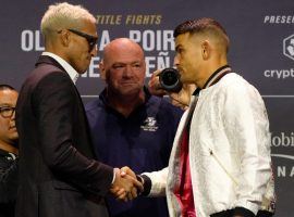 Charles Oliveira (left) will defend his lightweight title against Dustin Poirier (right) at UFC 269 on Saturday. (Image: Jeff Bottari)