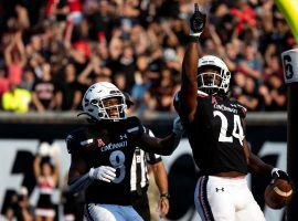 The upset-minded Cincinnati Bearcats will take on the Alabama Crimson Tide at the Cotton Bowl in a College Football Playoff semifinal. (Image: Albert Cesare/Enquirer/USA Today)