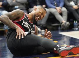 Damian Lillard from the Portland Trail Blazers got knocked to the floor after a foul by the Utah Jazz at Vivint Arena in Salt Lake City. (Image: Rick Bowmer/AP)