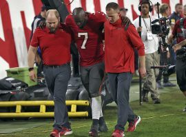 Tampa Bucs running back Leonard Fournette needs assistance off the field after a hamstring injury against the New Orleans Saints. (Image: Getty)
