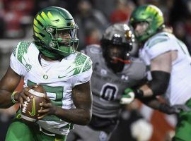The Oregon Ducks will look to avenge a 38-7 loss to Utah two weeks earlier when the teams meet for a rematch Friday in the Pac-12 Championship. (Image: Alex Goodlett/AP)