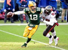 Aaron Rodgers from the Green Bay Packers is chased down from a defender from the Tampa Bay Bucs in last year’s NFC Championship. (Image: Benny Sieu/USA Today Sports)