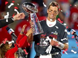 Tom Brady holds the Lombardi Trophy after he led the Tampa Bay Bucs to a victory in Super Bowl 55. (Image: Mark J. Rebilas/USA Today Sports)