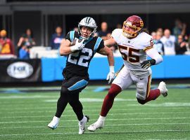 Christian McCaffrey (22), the starting running back from the Carolina Panthers, evades Cole Holcomb from the Washington Football Team. (Image: Bob Donnan/USA Today Sports)