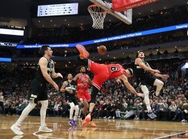 Alex Caruso (6) from the Chicago Bulls gets fouled hard by Grayson Allen (far right) from the Milwaukee Bucks at Fiserv Arena. (Image: John J. Kim/Getty)