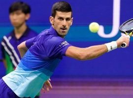Novak Djokovic is both the top seed and the favorite in the 2022 Australian Open, though it isn’t entirely certain he will play in the event. (Image: Elise Amendola/AP)