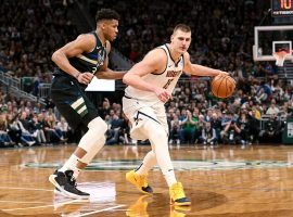 Giannis 'Greek Freak' Antetokounmpo from the Milwaukee Bucks defends Nikola Jokic of the Denver Nuggets at the Fiserv Arena in Milwaukee. (Image: Dylan Buell/Getty)