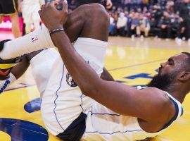 Tim Hardaway, Jr from the Dallas Mavs grabs his left foot after a freak injury caused a fracture in a game against the Golden State Warriors at Chase Center in San Francisco. (Image: Getty)