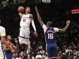 Ja Morant from the Memphis Grizzlies winds back for a fierce slam dunk over Joe Johnson of the Brooklyn Nets. (Image: Wendell Cruz/USA Today Sports)