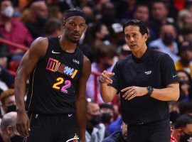 Jimmy Butler from the Miami Heat discusses in-game adjustments with head coach Erik Spoelstra during a recent victory over the LA Lakers. (Image: Michael Reaves/Getty)
