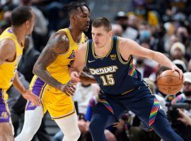 Nikola Jokic from the Denver Nuggets makes a move against Dwight Howard from the Los Angeles Lakers and secured his eighth triple-double of the season. (Image: Porter Lambert/Getty)