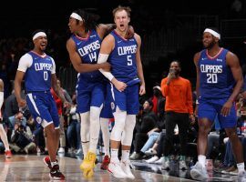 Terance Mann (14) from LA Clippers celebrates with Luke Kennard (5) after Kennard connected on a four-point play to complete a 35-point comeback against the Washington Wizards. (Image: Getty)