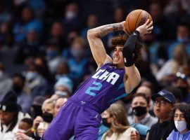 LaMelo Ball from the Charlotte Hornets tries to pass while falling out of bounds during a rare loss to the Orlando Magic. (Image: Grant Halverson/Getty)