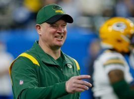 Nathaniel Hackett, former offensive coordinator with the Green Bay Packers, chatting with players during pre-game warmups in 2021. (Image: Duane Burleson/AP)