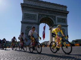 Tadej Pogacar rides into Paris in the final stage of the 2021 Tour de France to secure his second-consecutive yellow jersey for UAE Team Emirates. (Image: Getty)