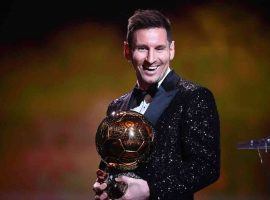 Lionel Messi posing with the Ballon d'Or trophy in December, when he won a record-breaking seventh trophy. (Image: telanganatoday.com)
