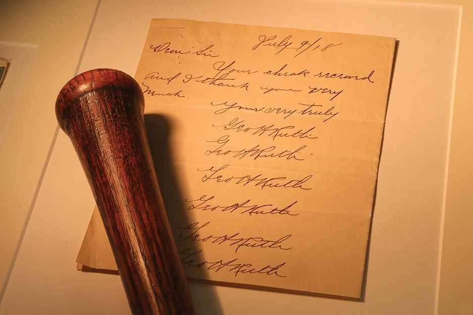 The MINT25 auction features a rare Babe Ruth bat contract.