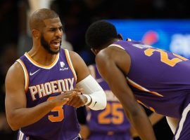 Chris Paul from the Phoenix Suns clutches his right thumb after a freakish injury against the Houston Rockets. (Image: Getty)