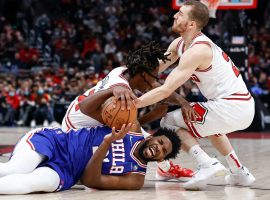 Joel Embiid from the Philadelphia 76ers dives on to the court for a loose ball against the Chicago Bulls in a huge win for Philly. (Image: Kamil Krzaczynski/USA Today Sports)