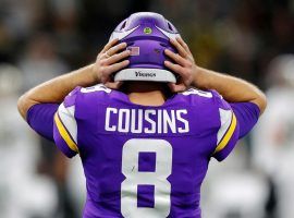 Kirk Cousins from the Minnesota Vikings struggles to hear a play called into his helmet during a game against the New Orleans Saints at the Superdome in 2020. (Image: Kevin C. Cox/Getty)