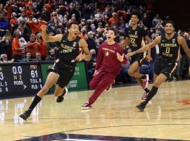 Matthew Cleveland is chased by his teammates at Florida State after he hit a buzzer beater to defeat Virginia at John Paul Jones Arena. (Image: USA Today Sports)