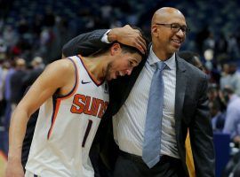 Monty Williams, head coach from the Phoenix Suns. congratulates Devin Booker after a recent win. (Image: Getty)