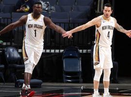 Zion Williamson (1) from the New Orleans Pelicans gets congratulated by teammate JJ Redick (4) last season. (Image: Getty)