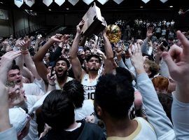 Bryant players and fans celebrate winning the NEC tournament and gaining a trip to March Madness despite the delay after a brawl broke out in the stands between Wagner and Bryant supporters. (Image: AP)