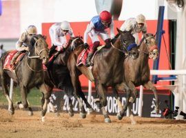 Country Grammer and Frankie Dettori pulled away for a 1 3/4-length victory over Hot Rod Charlie to win the $12 million Group 1 Dubai World Cup. (Image: Dubai Racing Club/Cedric Lane)