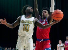 Jordan 'Jelly' Walker (10) from UAB drives the lane against Louisiana Tech defender Amorie Archibald (3) in the Conference USA tournament. (Image: LM Otero/AP)