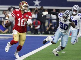 Jimmy Garoppolo from the San Francisco 49ers evades a pass rush against the San Francisco 49ers in the NFC Wild Card game, where Jimmy G suffered a shoulder injury that requires surgery. (Image: Richard Rodriguez/Getty)