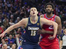 MVP favorites Nikola Jokic from the Denver Nuggets and Joel Embiid of the Philadelphia 76ers contend for a rebound after a missed free throw. (Image: Porter Lambert/Getty)