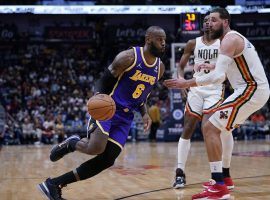 LeBron James from the LA Lakers blows by Jonas Valanciunas from the New Orleans Pelicans ay at the Smoothie King Center. (Image: Gerald Herbert/AP)