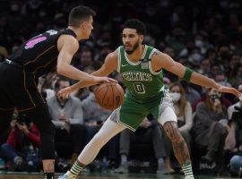 Jayson Tatum from the Boston Celtics defends Tyler Herro from the Miami Heat in a recent game, but both teams are fighting for the #1 seed in the Eastern Conference playoffs. (Image: AP)