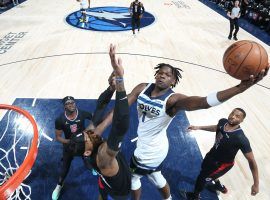 Anthony Edwards from the Minnesota Timberwolves throws down a dunk during a fourth-quarter run to cap a comeback victory against the LA Clippers. (Image: David Sherman/Getty)