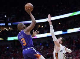 Chris Paul from the Phoenix Suns shoots a one-handed runner against Jonas Valanciunas of the New Orleans Pelicans at the Smoothie King Center. (Image: Gerald Herbert/Getty)