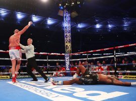 Tyson Fury (left) retained his WBC heavyweight championship by knocking out Dillian Whyte (right) at Wembley Stadium on Saturday night. (Image: Julian Finney/Getty)