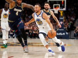 Steph Curry from the Golden State Warriors blows by Boogie Cousins from the Denver Nuggets. (Image: Getty)