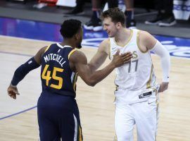 Donovan Mitchell from the Utah Jazz and Luka Doncic from the Dallas Mavs prior to the opening tip earlier this season. (Image: Getty)