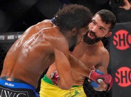Patricio “Pitbull” Freire (right) defeated the formerly undefeated AJ McKee (left) to win back the featherweight title at Bellator 277 on Friday. (Image: Jeff Chiu/AP)