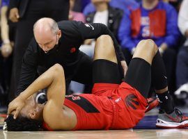 Medical staff attend to Scottie Barnes, a rookie forward with the Toronto Raptors, after he suffered an ankle injury in Game 1 against the Philadelphia 76ers.  (Image: Tim Nwachukwu/Getty)