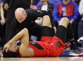 Medical staff attend to Scottie Barnes, a rookie forward with the Toronto Raptors, after he suffered an ankle injury in Game 1 against the Philadelphia 76ers. Â (Image: Tim Nwachukwu/Getty)