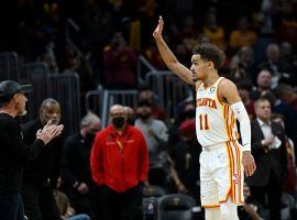 Trae Young from the Atlanta Hawks waves goodbye to the crowd in Rocket Mortgage FieldHouse after the Cleveland Cavs were knocked out of the Play-In Tournament. (Image: David Richard/Getty)