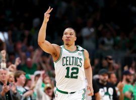 Grant Williams from the Boston Celtics flashes three fingers after he knocked down one of seven treys during a huge performance in Game 7 against the Milwaukee Bucks. (Image: Getty)