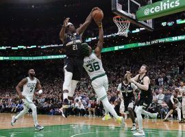 Marcus Smart from the Boston Celtics has his shot blocked by Jrue Holiday from the Milwaukee Bucks in Game 5 of the Eastern Conference Semifinal at TD Garden. (Image: AP)