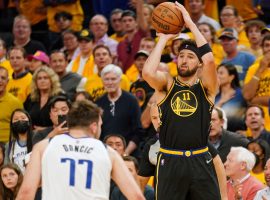 Klay Thompson from the Golden State Warriors shoots a 3-pointer over Luka Doncic from the Dallas Mavs in Game 5 of the Western Conference Finals at Chase Center in San Francisco. (Image: Getty)