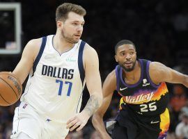 Luka Doncic of the Dallas Mavs blows by Mikal Bridges from the Phoenix Suns in Game 2, but Doncic is one of the favorites to score a triple-double in Game 3. (Image: Getty)