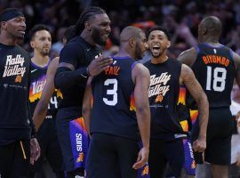 Members of the Phoenix Suns congratulate Chris Paul after he lit up the Dallas Mavs and tormented Luka Doncic in a Game 2 victory. (Image: Getty)