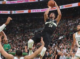 Giannis 'Greek Freak' Antetokounmpo gets off a jumper against the Boston Celtics while Jayson Tatum (0) looks on. (Image: Nathaniel Butler/Getty)