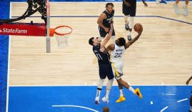Golden State Warriors forward Andrew Wiggins soars over Luka Doncic from the Dallas Mavs for a thunderous dunk. (Image: Getty)